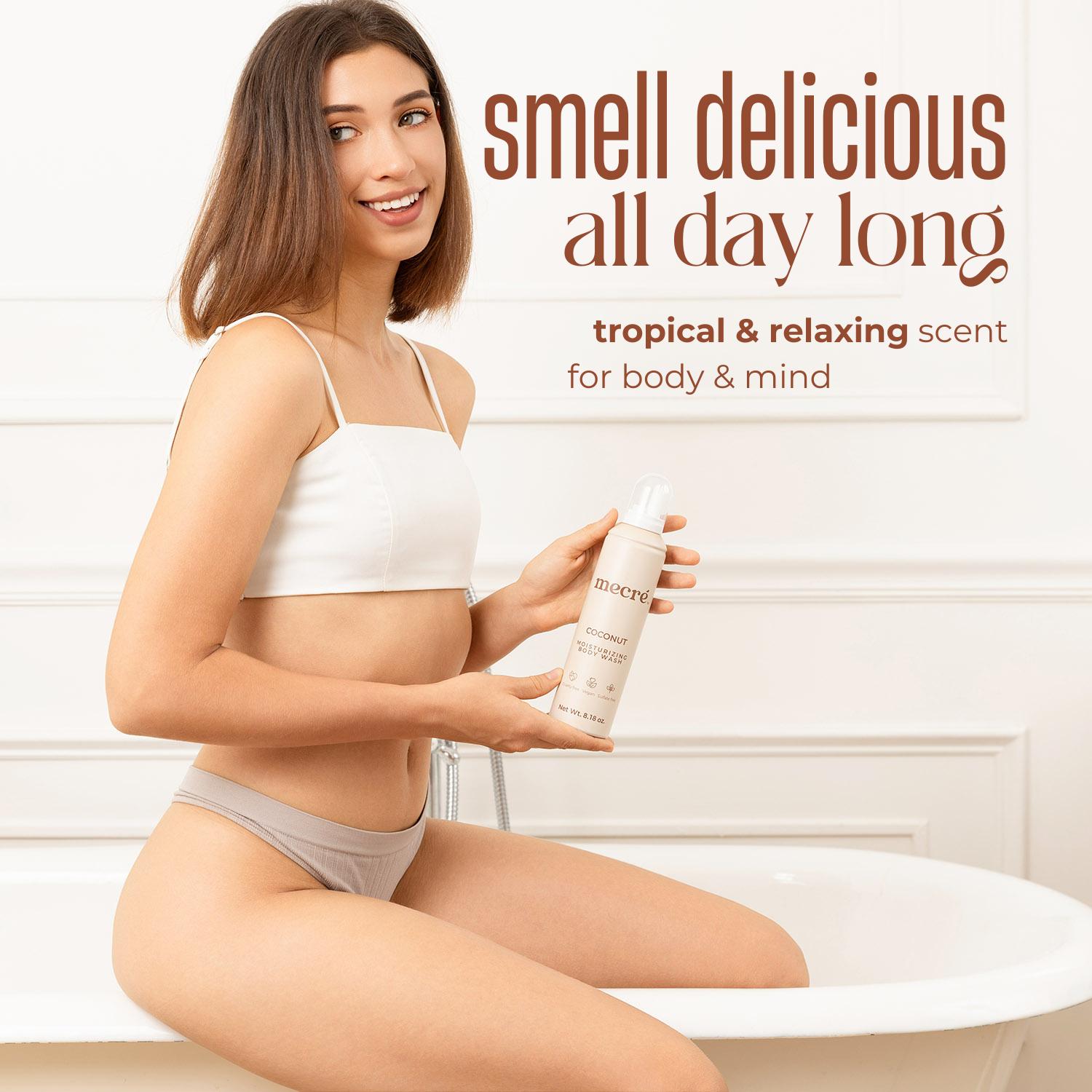 Girl sitting on the edge of a bathtub, smiling and holding a coconut mecré bottle. The image includes text that reads: “Smell delicious all day long, cool & clean scent for body & mind.”