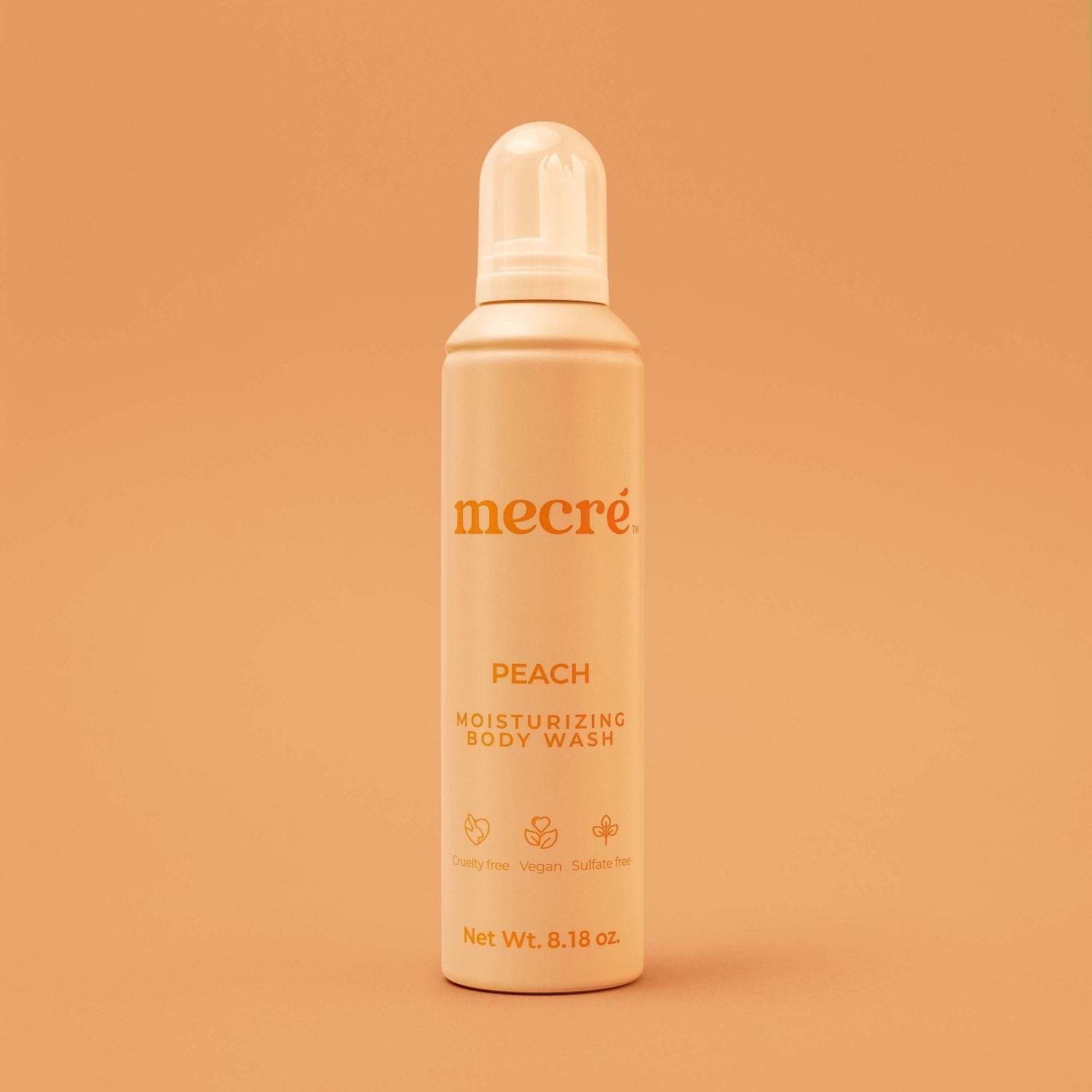 Front view of Mecré moisturizing body wash bottle in peach scent, featuring a light orange bottle.